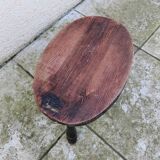 Old vintage oval tripod stool