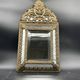 Small mirror with brass parcloses in repoussé style Louis XIV, late 19th century.