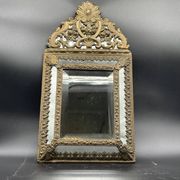Small mirror with brass parcloses in repoussé style Louis XIV, late 19th century.