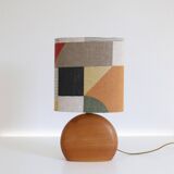 Small carved wooden floor lamp with oval shade