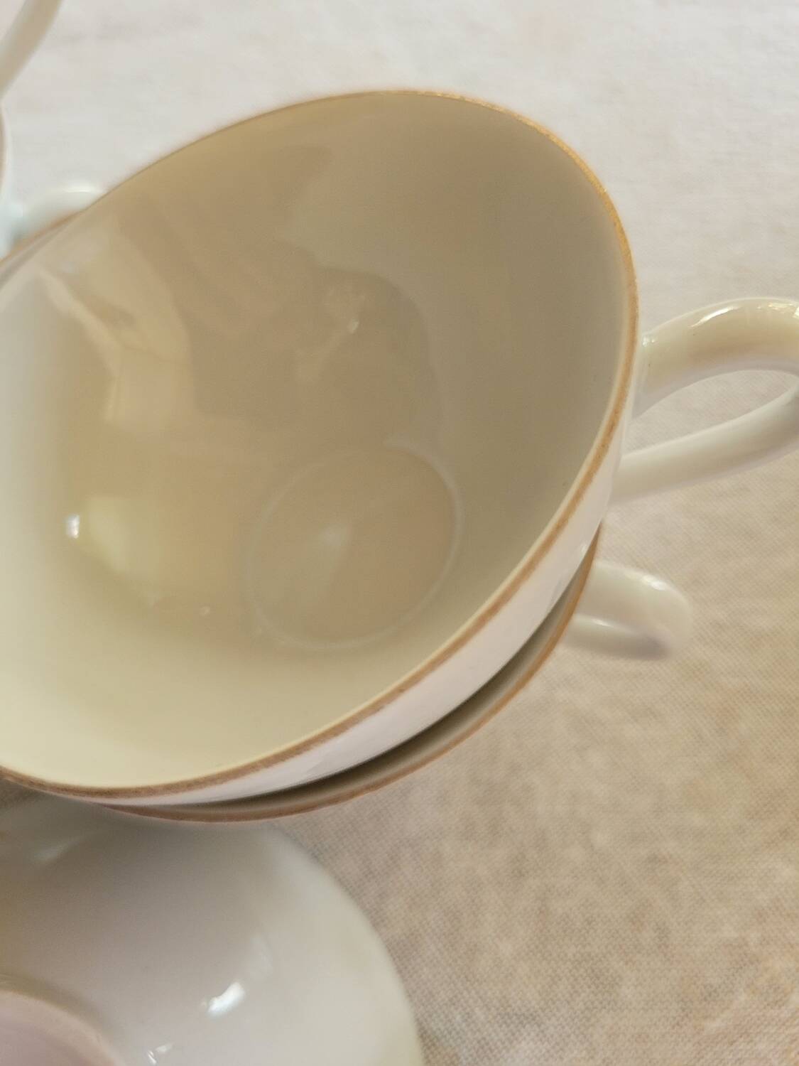 6 white and gold porcelain cups