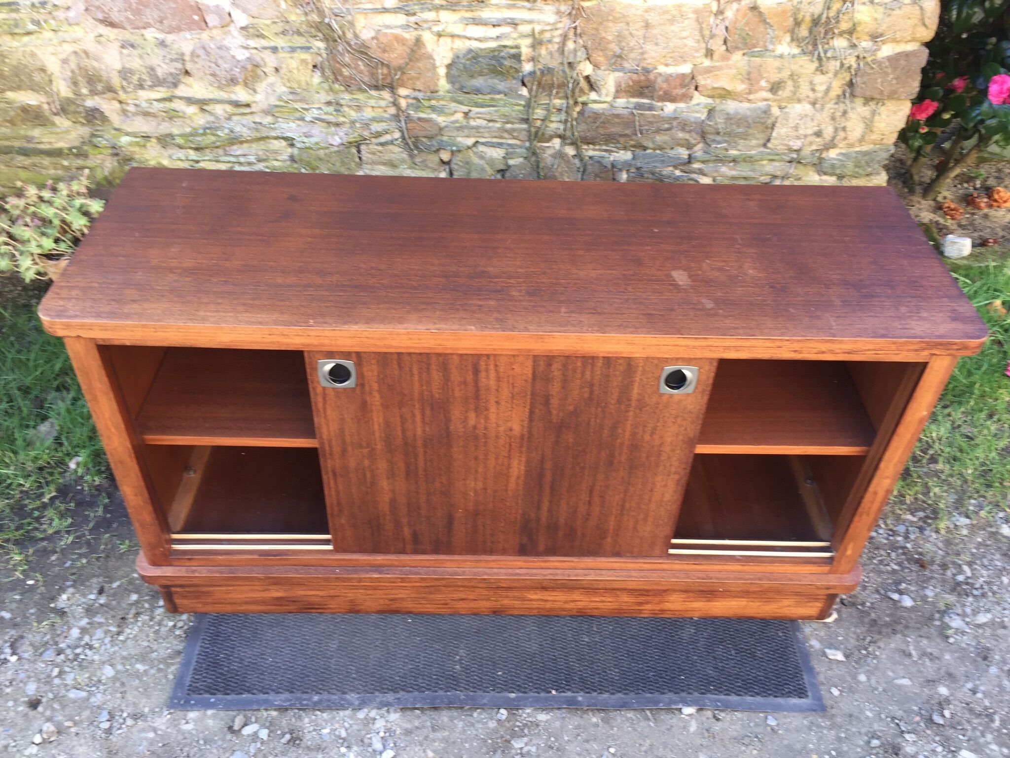 Low sideboard with sliding doors in waxed mahogany