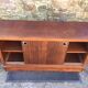 Low sideboard with sliding doors in waxed mahogany
