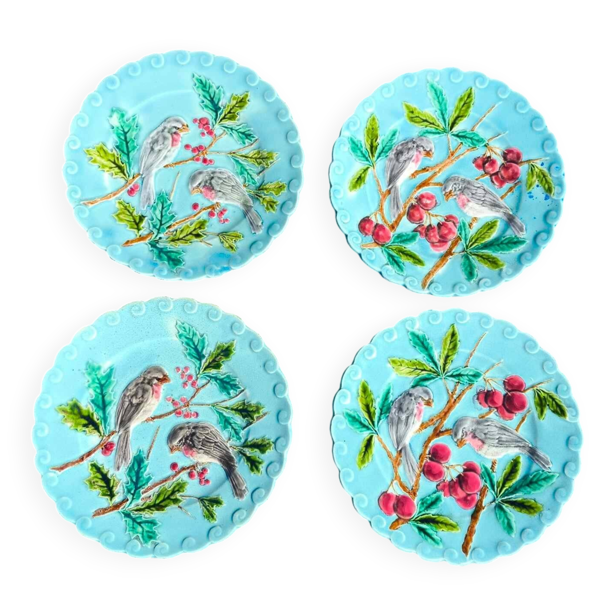4 anciennes assiettes en barbotine décor oiseaux en faïence de Sarreguemines
