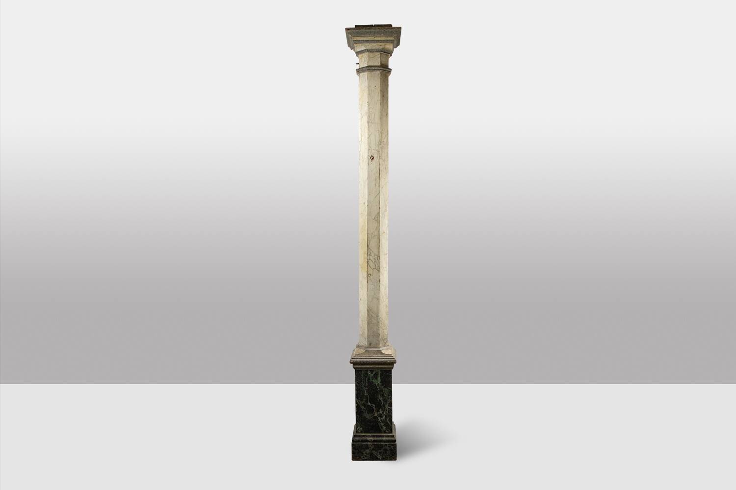 Pair of wooden columns painted to imitate marble. 1880s.