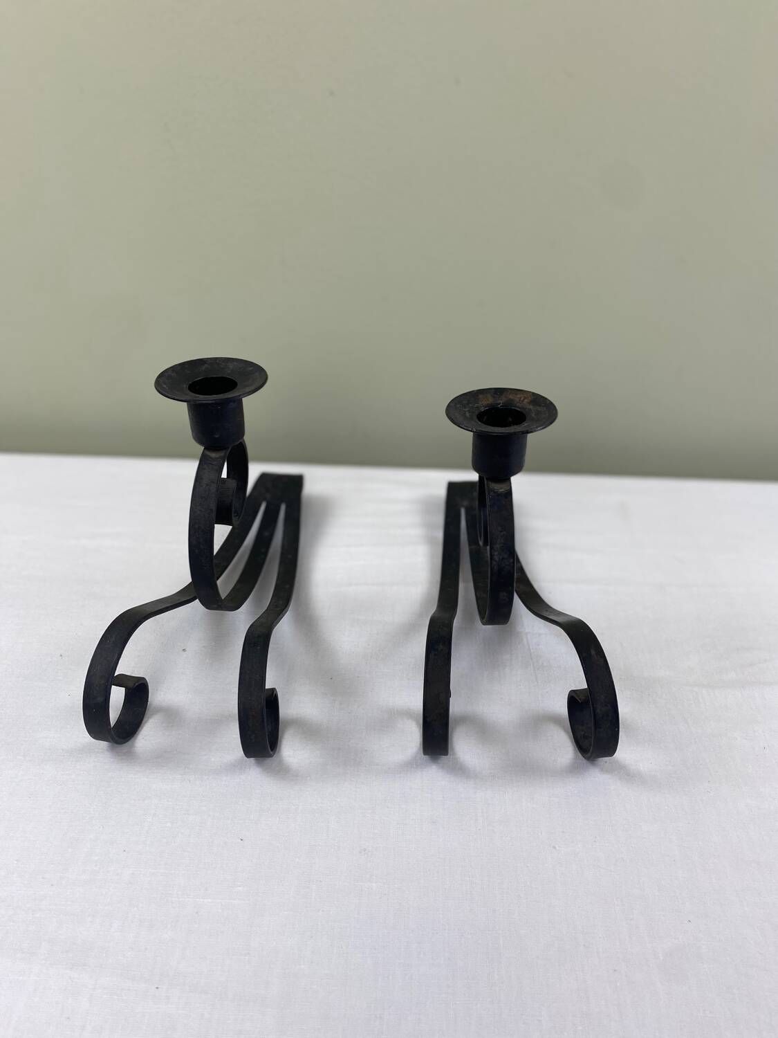 Pair of wrought iron candlesticks