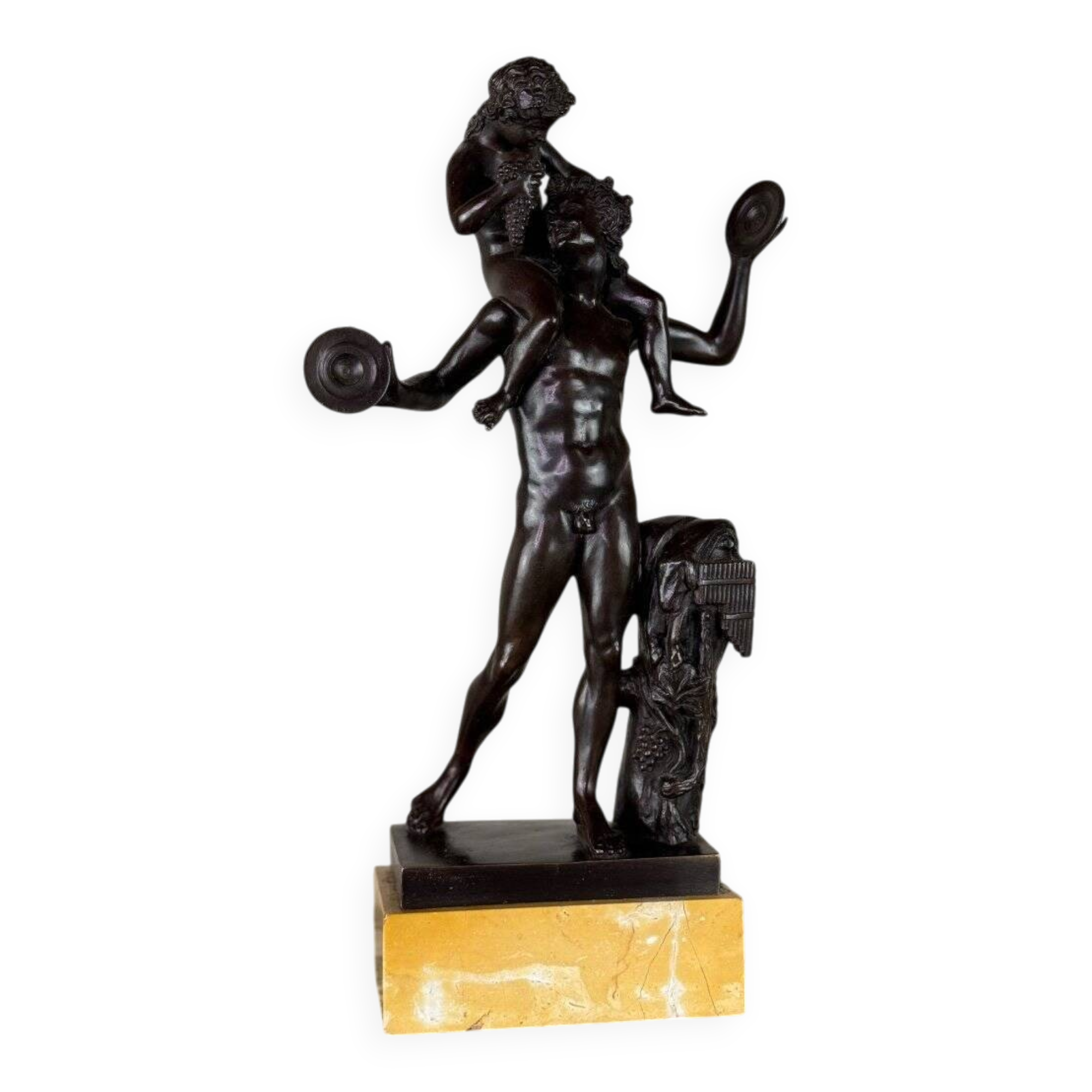 Dionysus on the shoulders of a satyr, bronze after the antique on a yellow Siena base.
