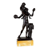 Dionysus on the shoulders of a satyr, bronze after the antique on a yellow Siena base.