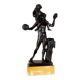 Dionysus on the shoulders of a satyr, bronze after the antique on a yellow Siena base.