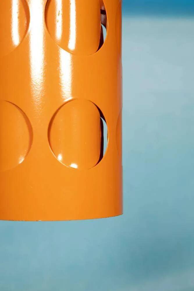 Vintage orange suspension light in a 1970s space age style.