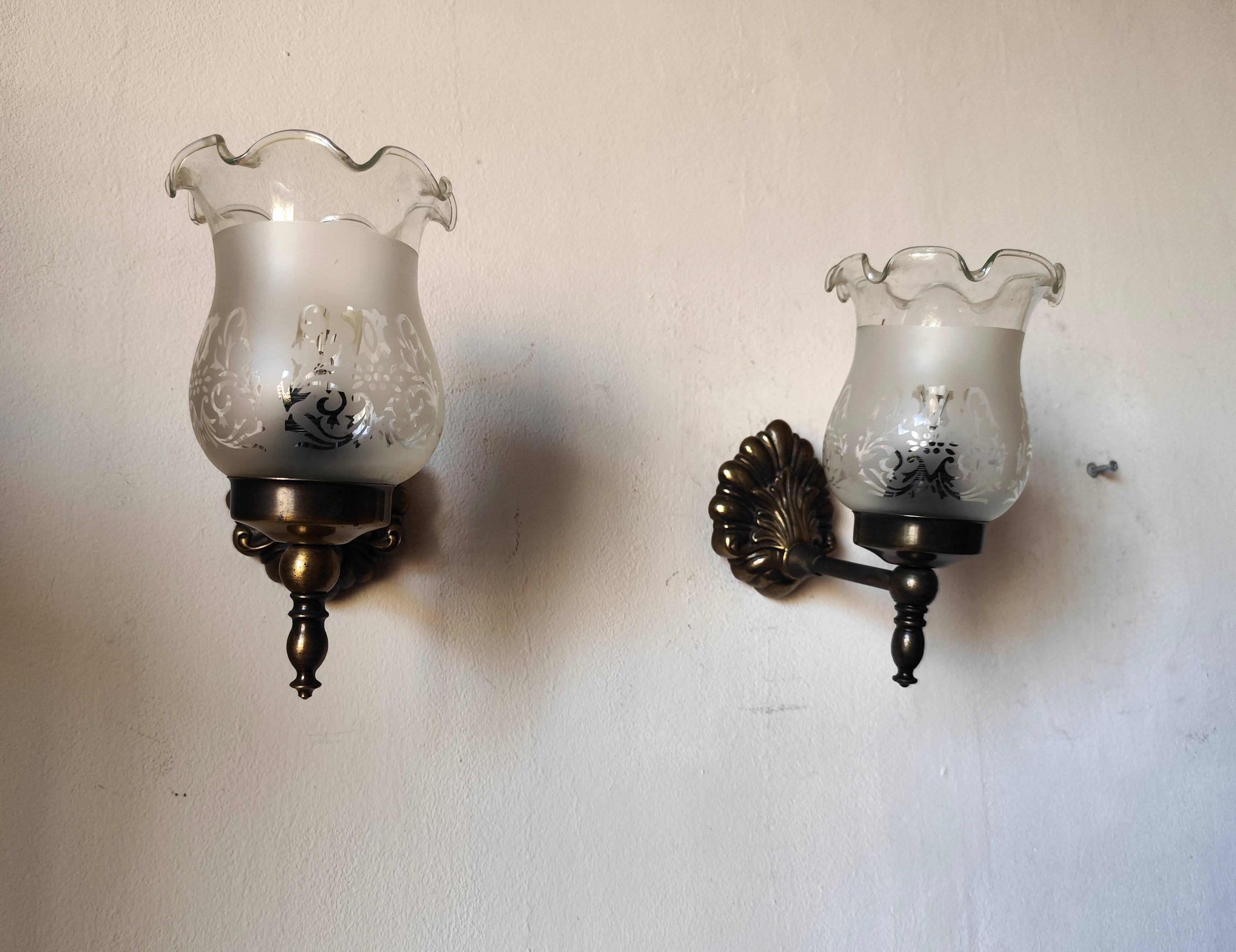 Pair of wall sconces in bronze with opaline glass tulips.