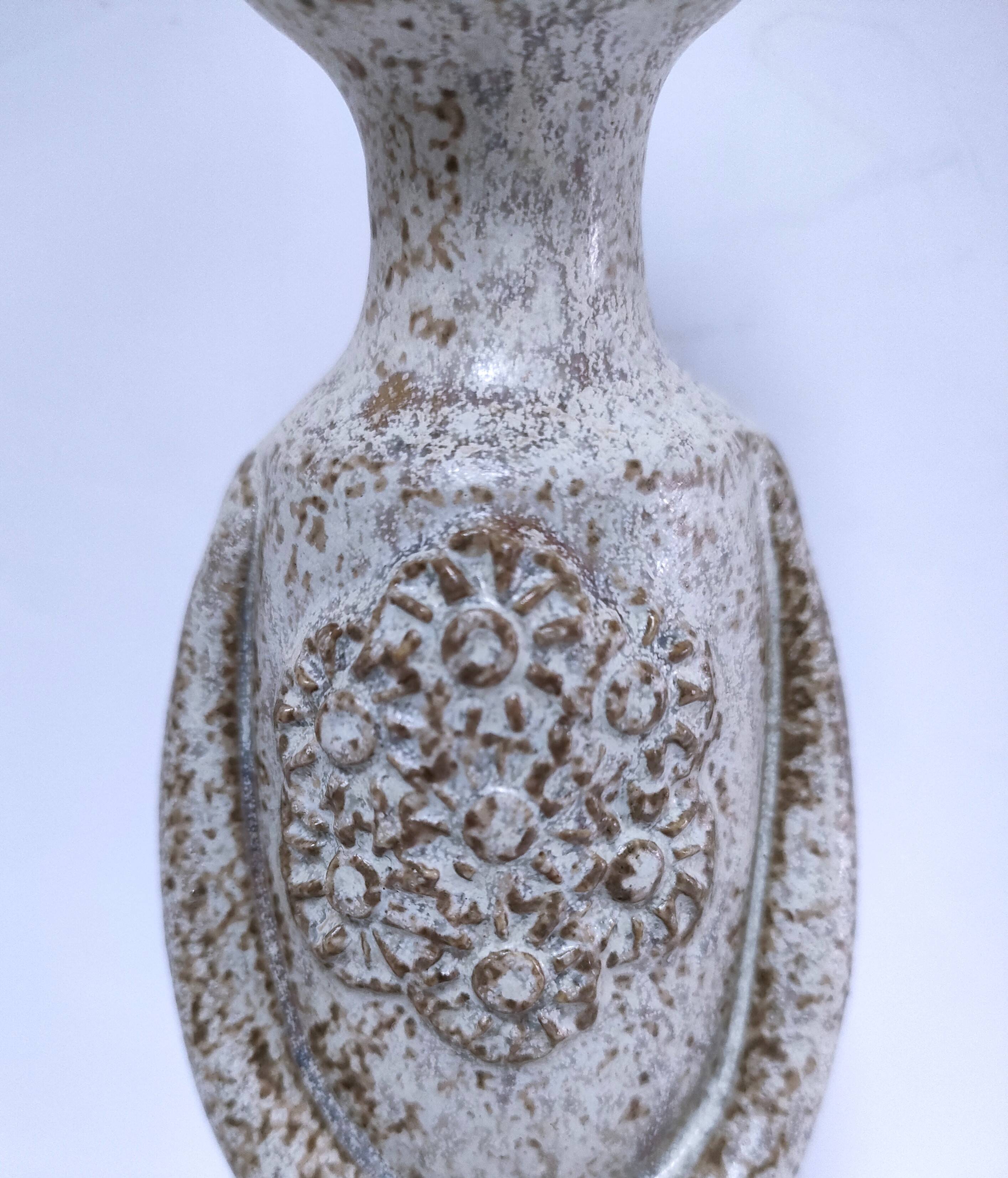 ceramic candle holder with crowned head signed P