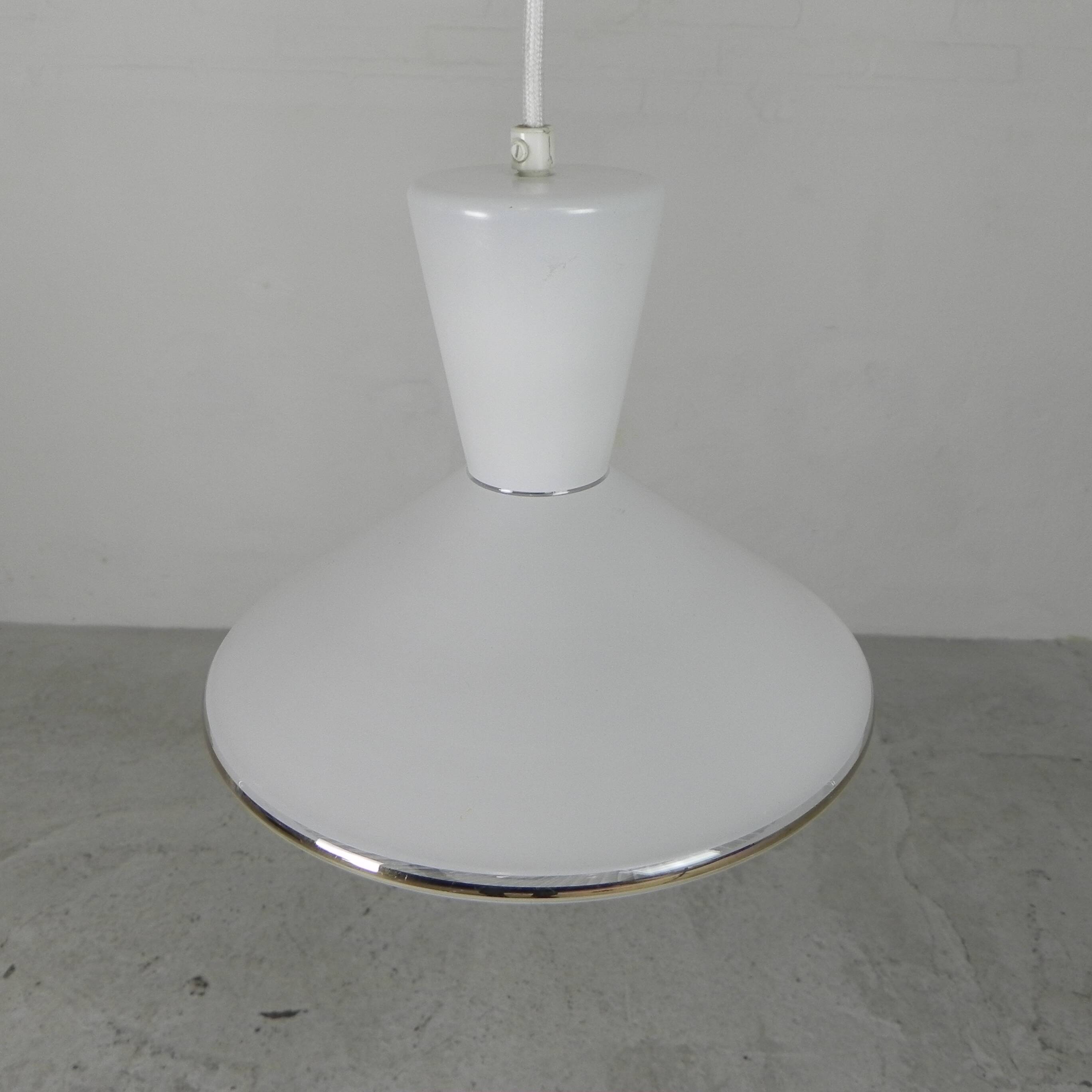 UFO-shaped pendant lamp with white glass on top and clear glass with white