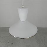 UFO-shaped pendant lamp with white glass on top and clear glass with white