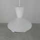 UFO-shaped pendant lamp with white glass on top and clear glass with white