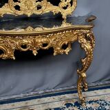 Mirror set with baroque style gilded wood console on marble top.