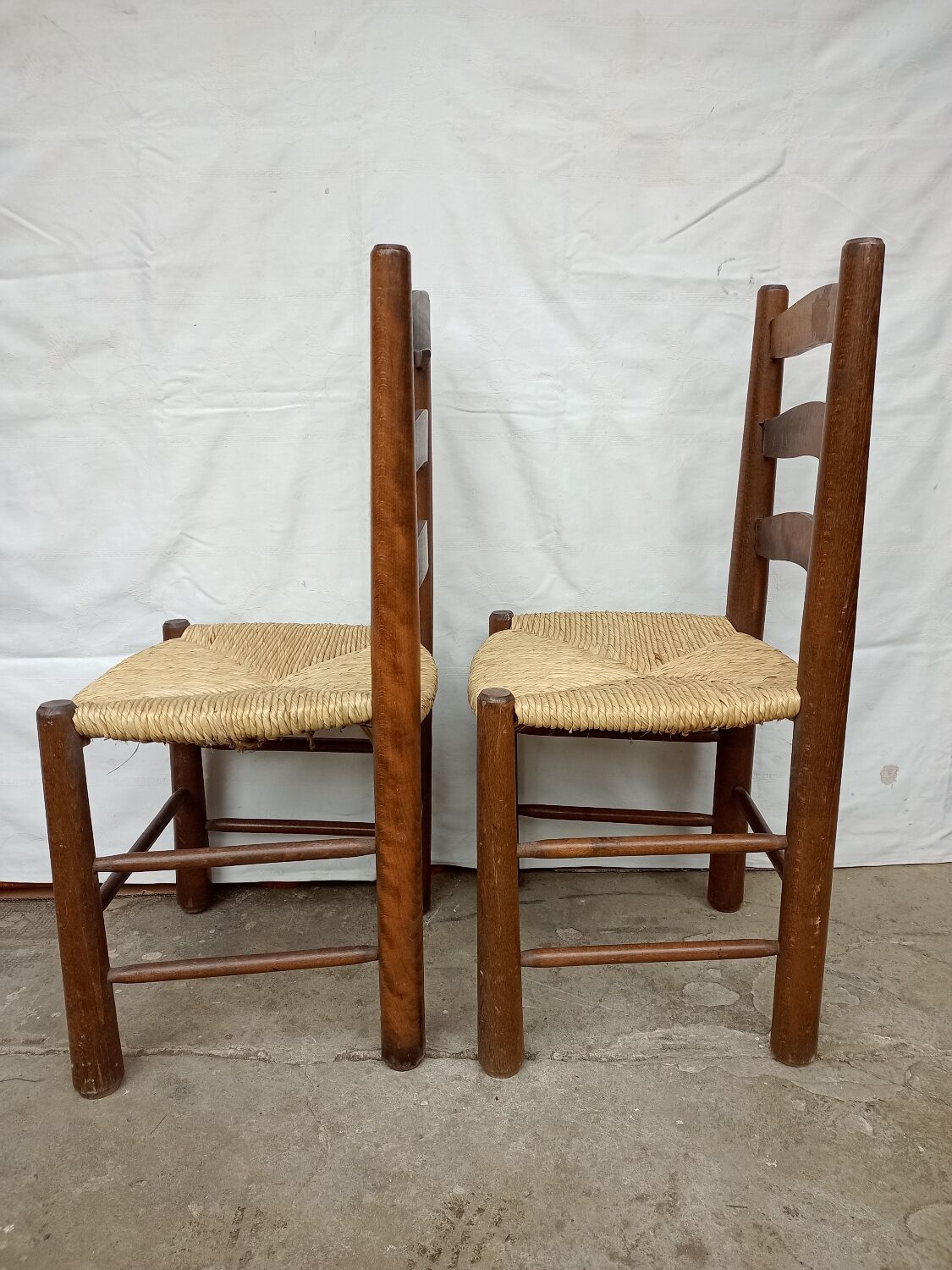 Brutalist chairs in walnut and straw