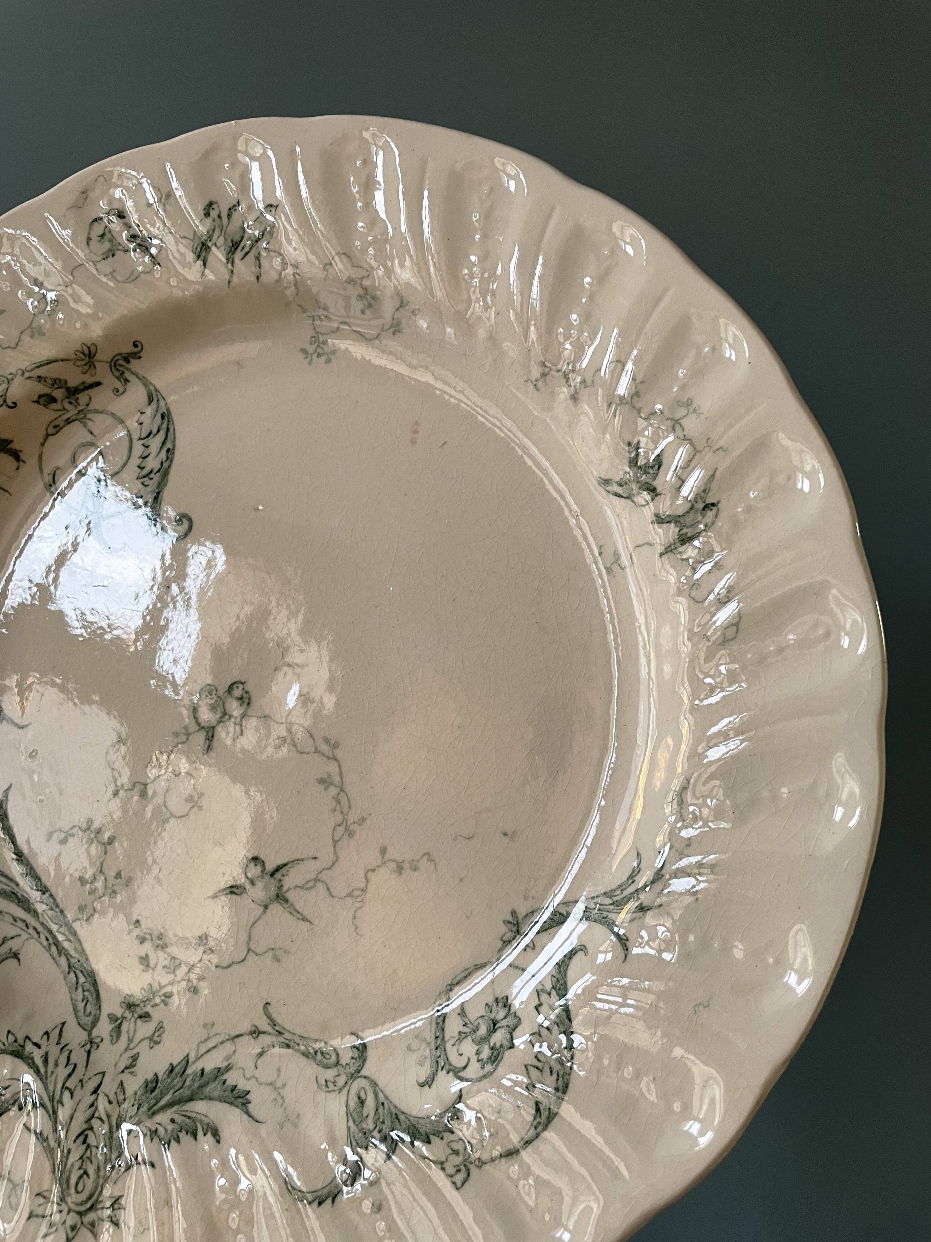 Set of 12 flat plates Terre De Fer XIXth in opaque porcelain of Gien, model Rinceaux