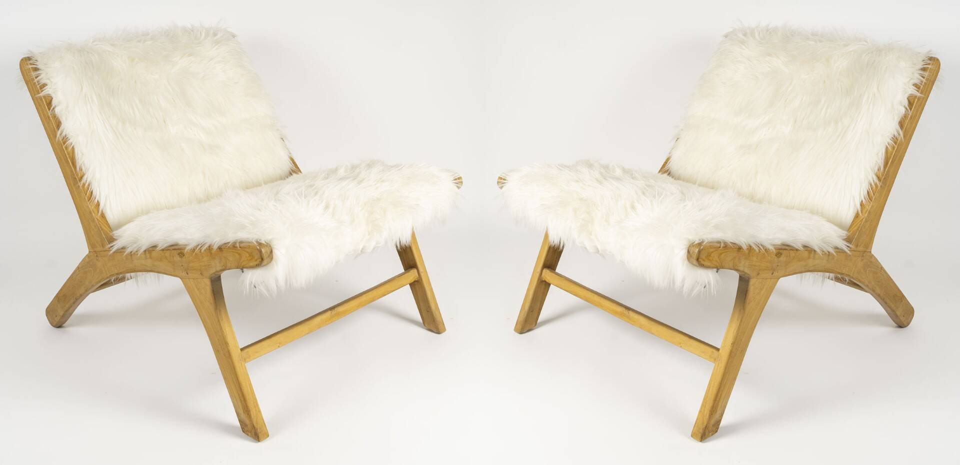 Pair of low chairs by olivier de schrijver