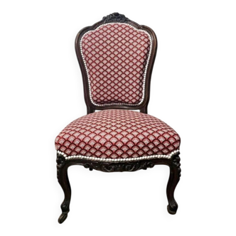 Napoleon III armchair reinterpreted – carved wood and shell pattern fabric