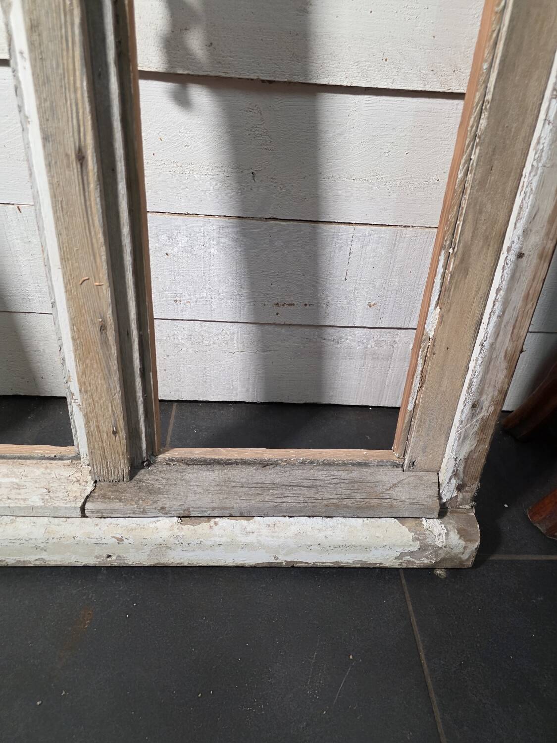 Old arched window made of fir wood