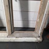 Old arched window made of fir wood