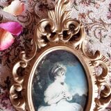 Medallion frame representing a little girl