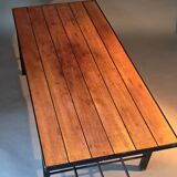 Vintage modernist coffee table in teak and black metal.