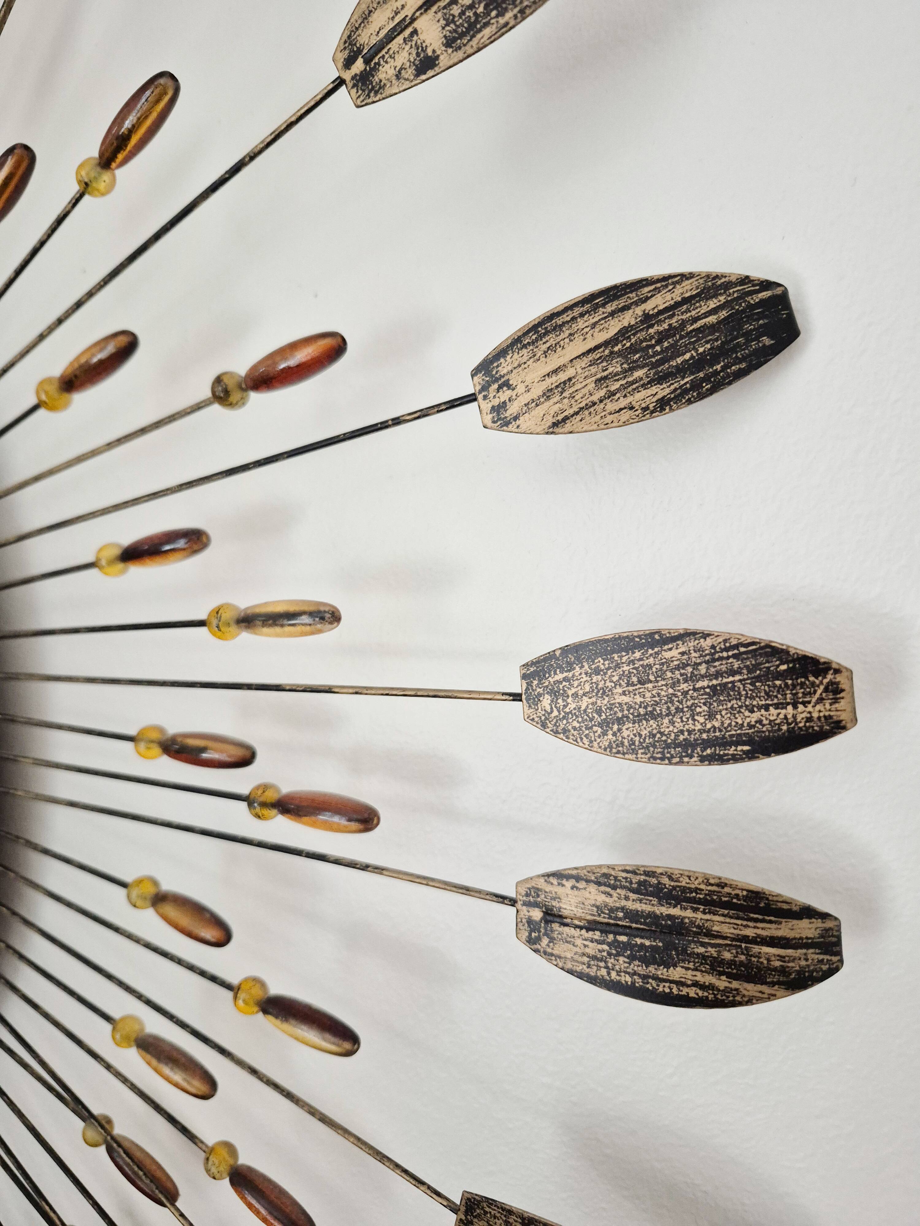 Vintage metal sun mirror in the style of Line Vautrin