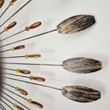 Vintage metal sun mirror in the style of Line Vautrin