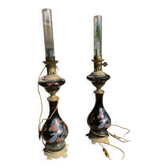 Pair of napoleon lamps in black opaline decorated with peacocks