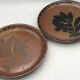 Lot 2 assiettes en grès pyrité émaillé à décor floral h. siegfried, souffle