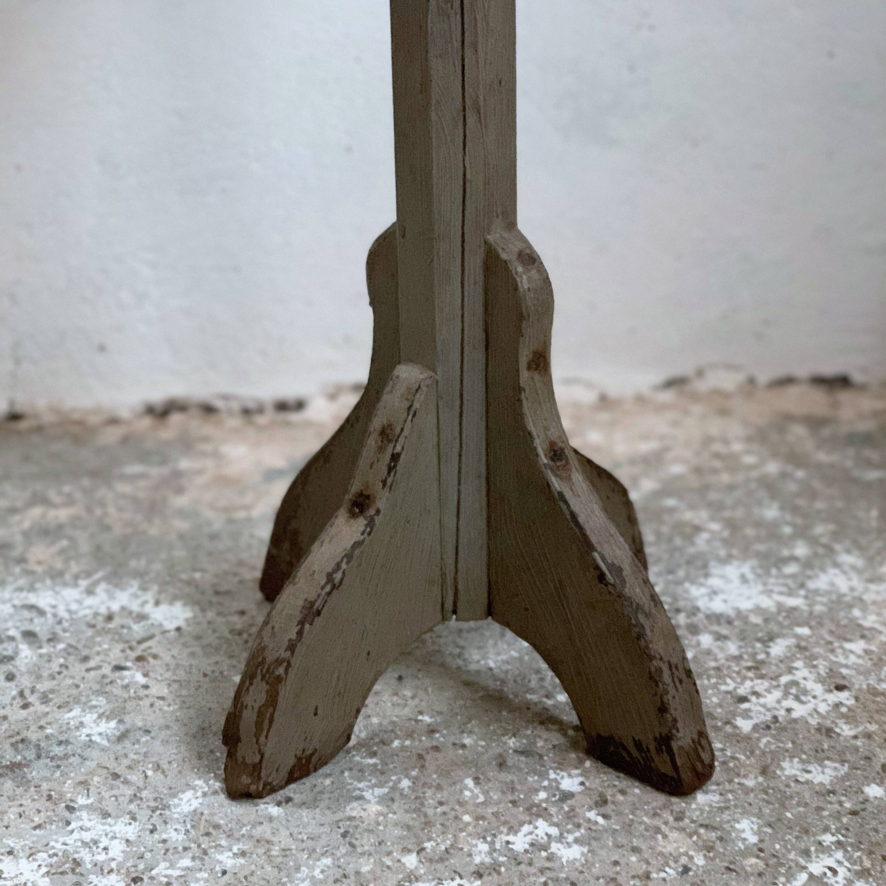 wooden pedestal or primitive winemaker's table