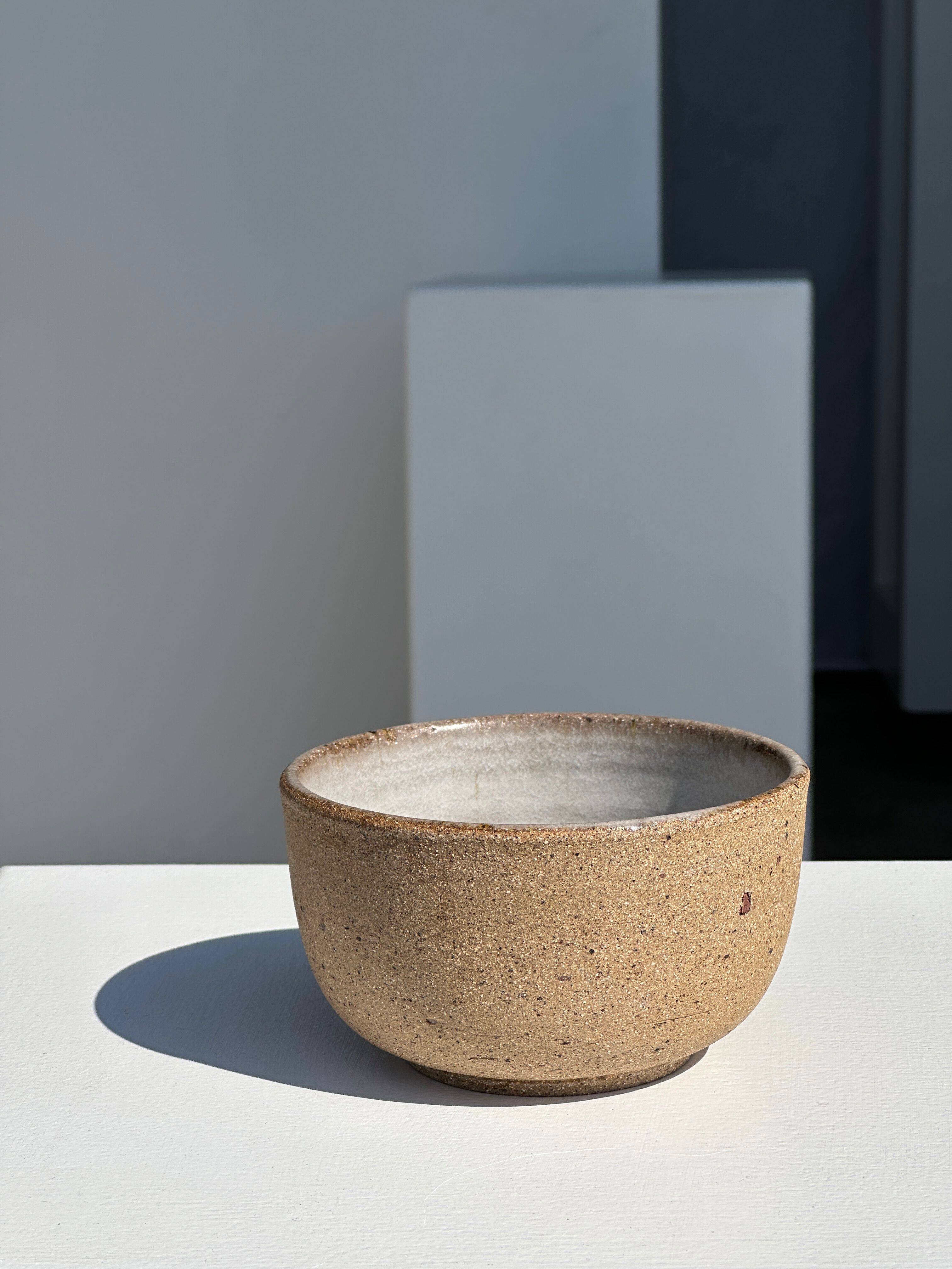 Small brown bowl inside blue and white