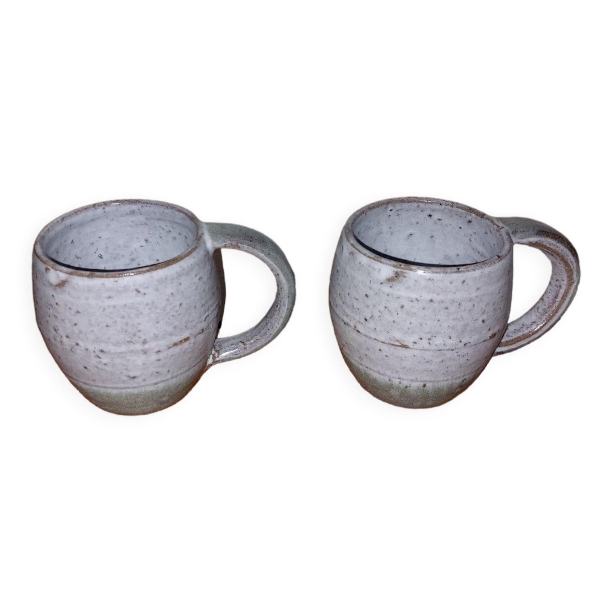 Two glazed stoneware mugs
