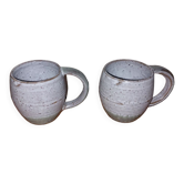 Two glazed stoneware mugs