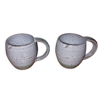 Two glazed stoneware mugs