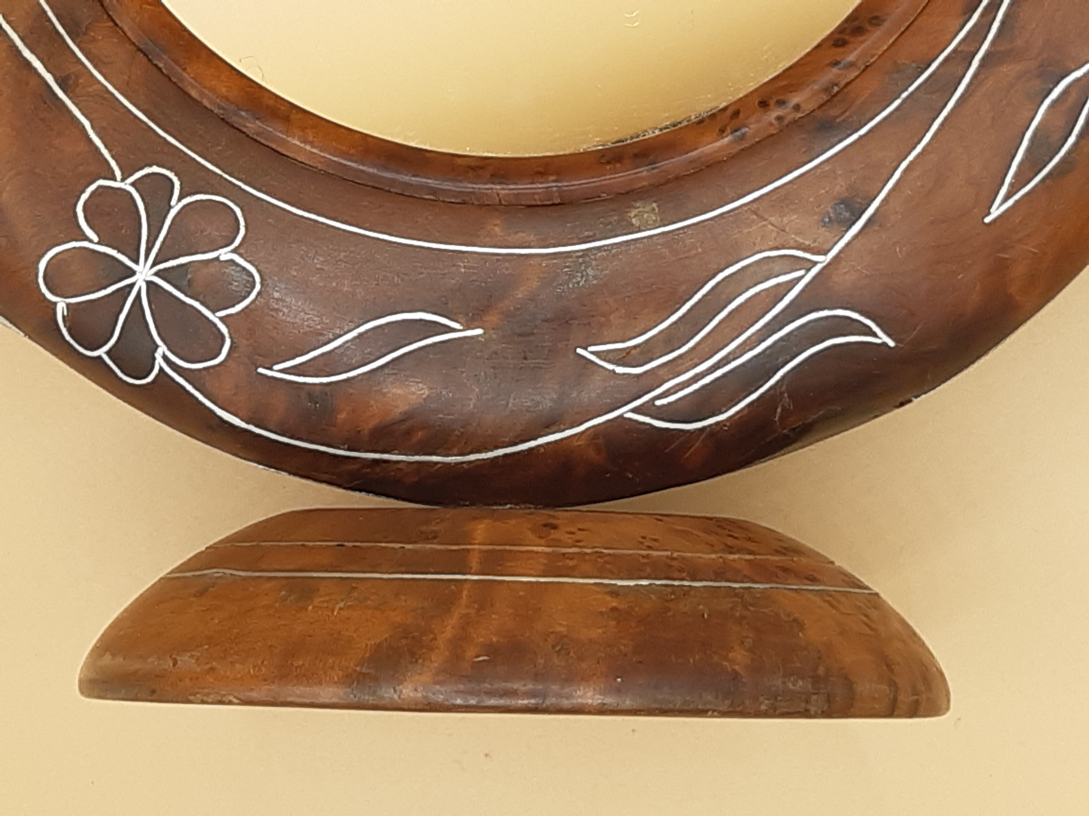 Antique mirror on wooden stand and metal net