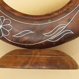 Antique mirror on wooden stand and metal net