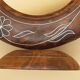 Antique mirror on wooden stand and metal net