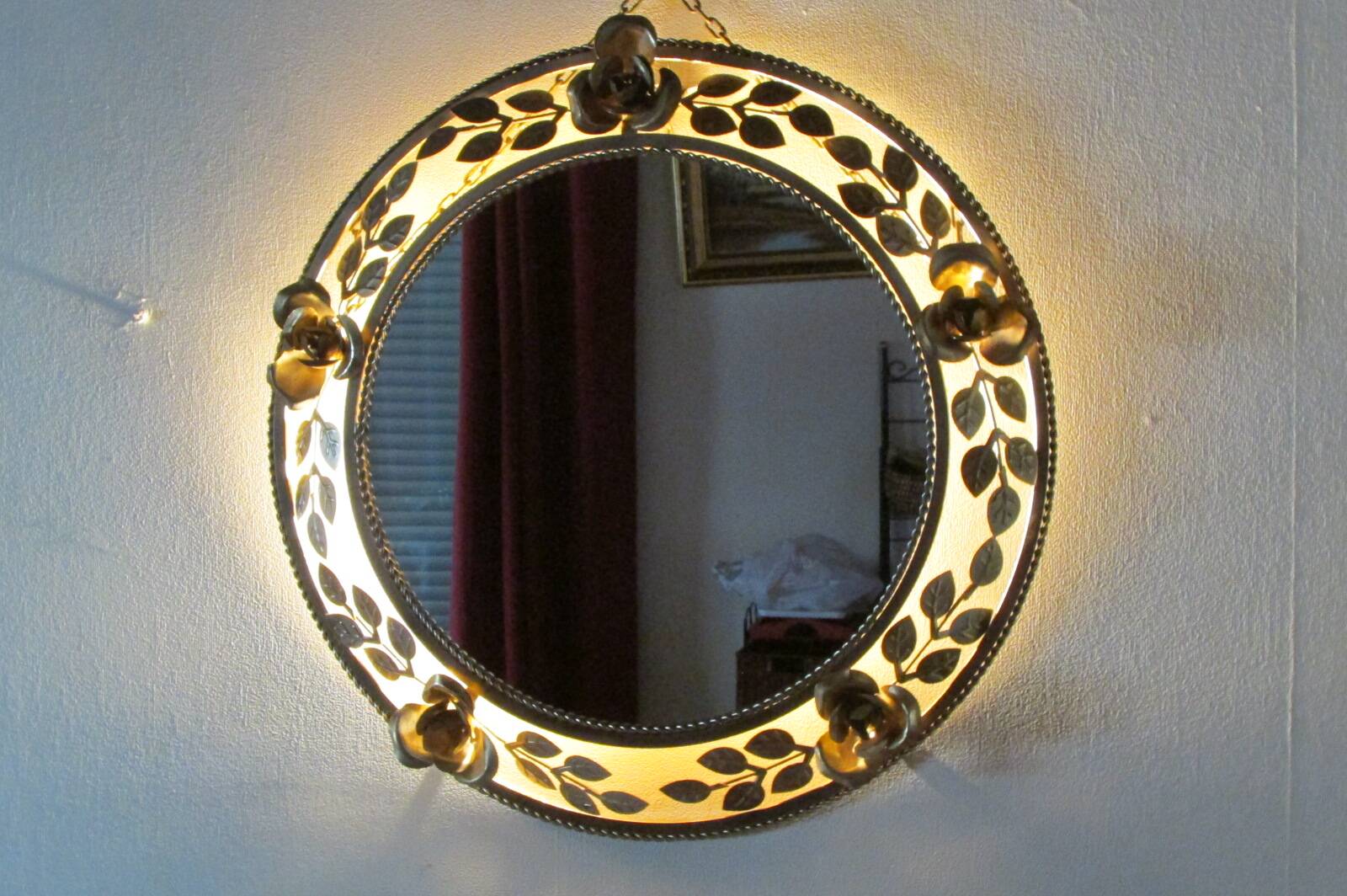 Round gold metal mirror, rose crown