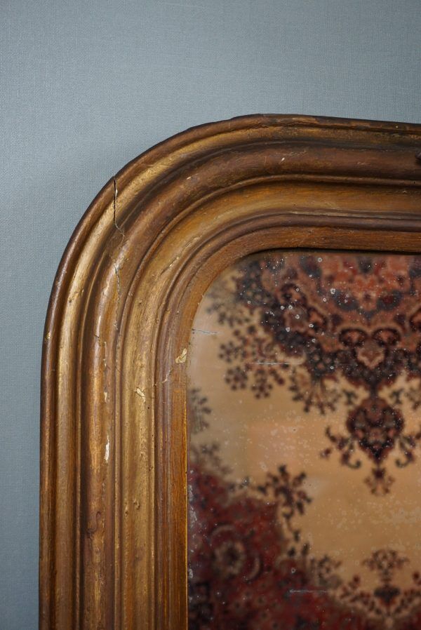 Old French fireplace mirror with beautiful ornament