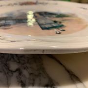 Round obernai dish in Sarreguemines earthenware, signed Loux
