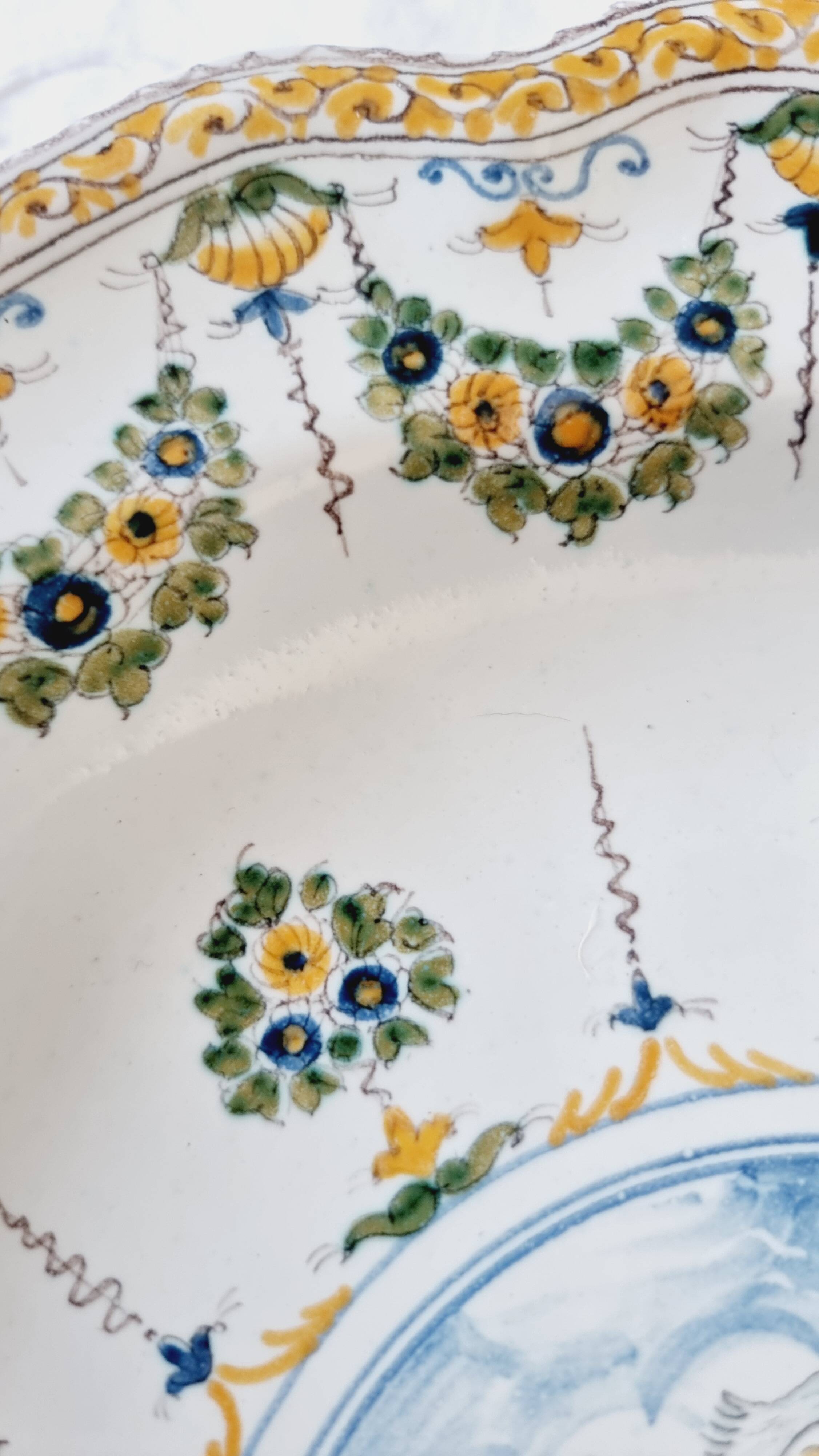 Antique plate in Moustiers faience, hand-painted, decorated with an s