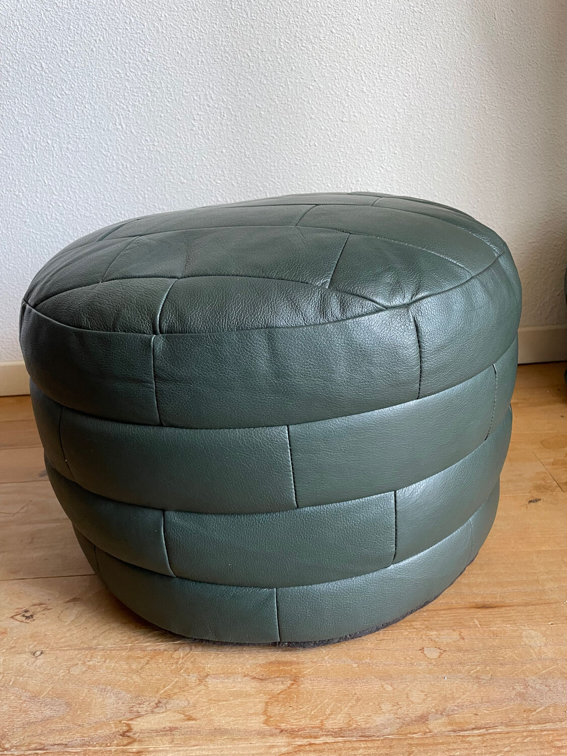 Green patchwork leather pouf from Sède