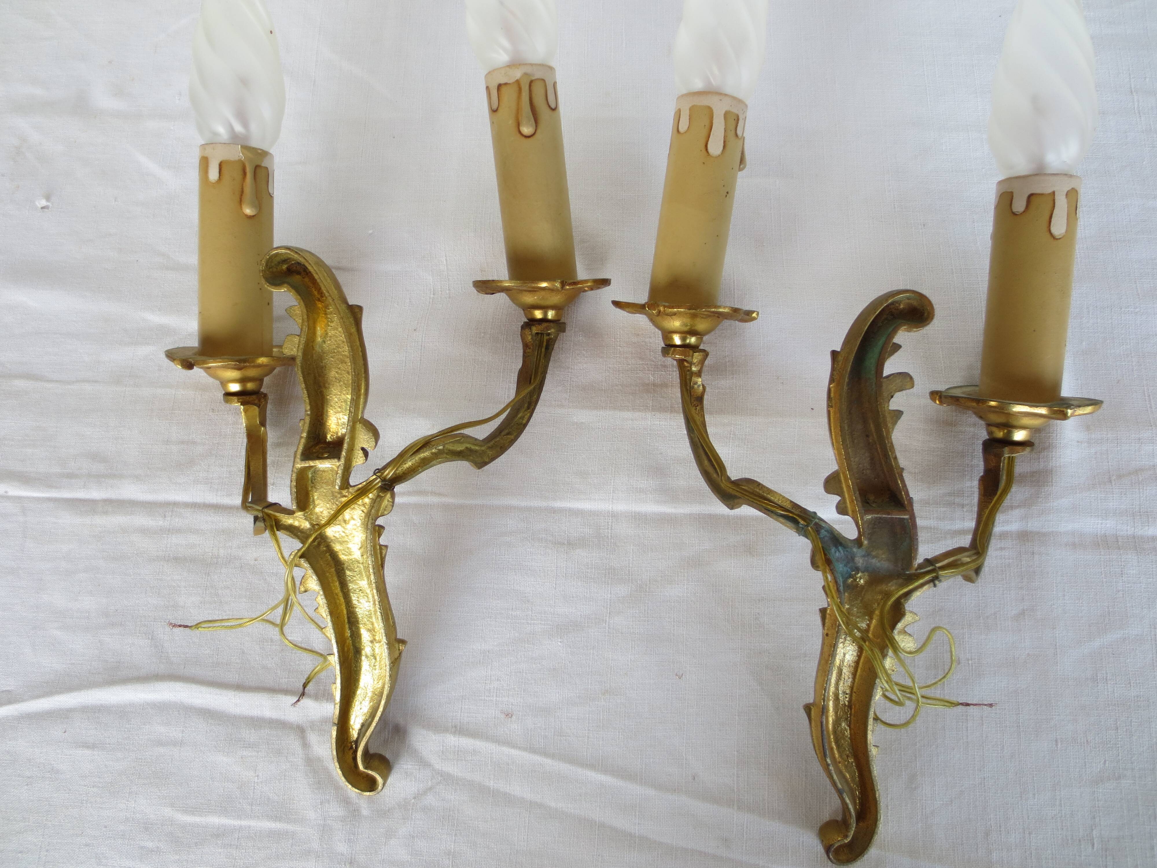Pair of double wall lights in gilded bronze