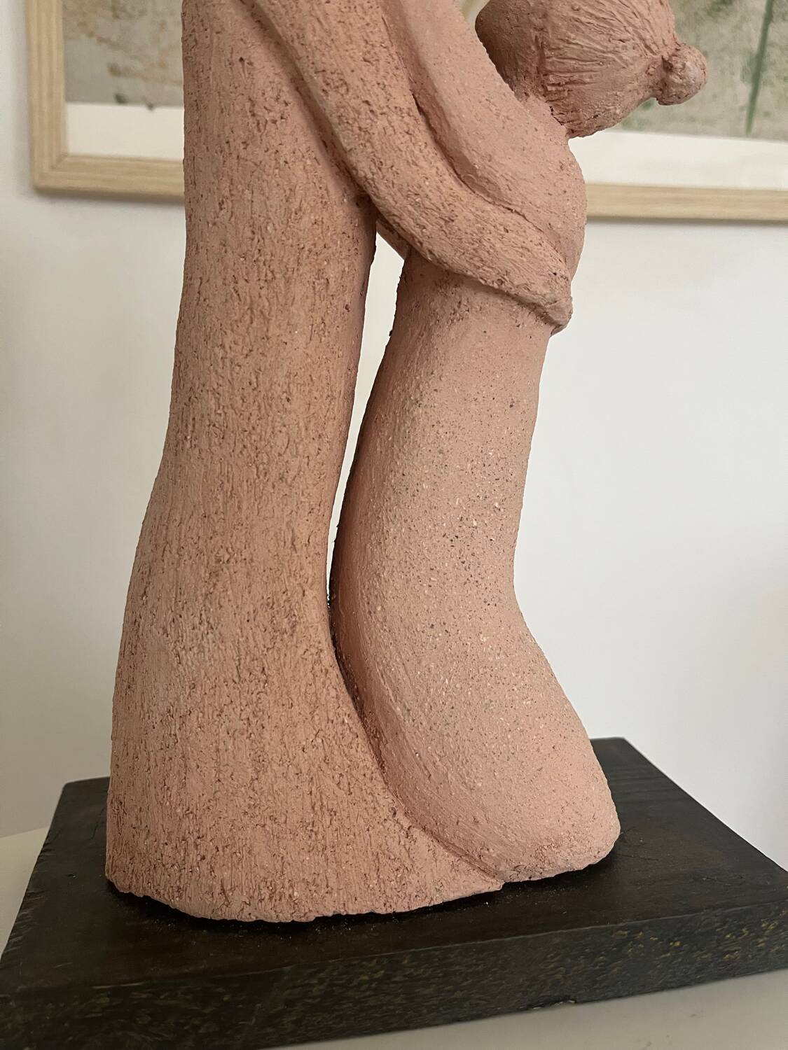 Sculpture of a couple entwined in grog clay.