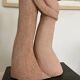 Sculpture of a couple entwined in grog clay.