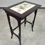 Nested tables in curved wood with ceramic top by Thonet.