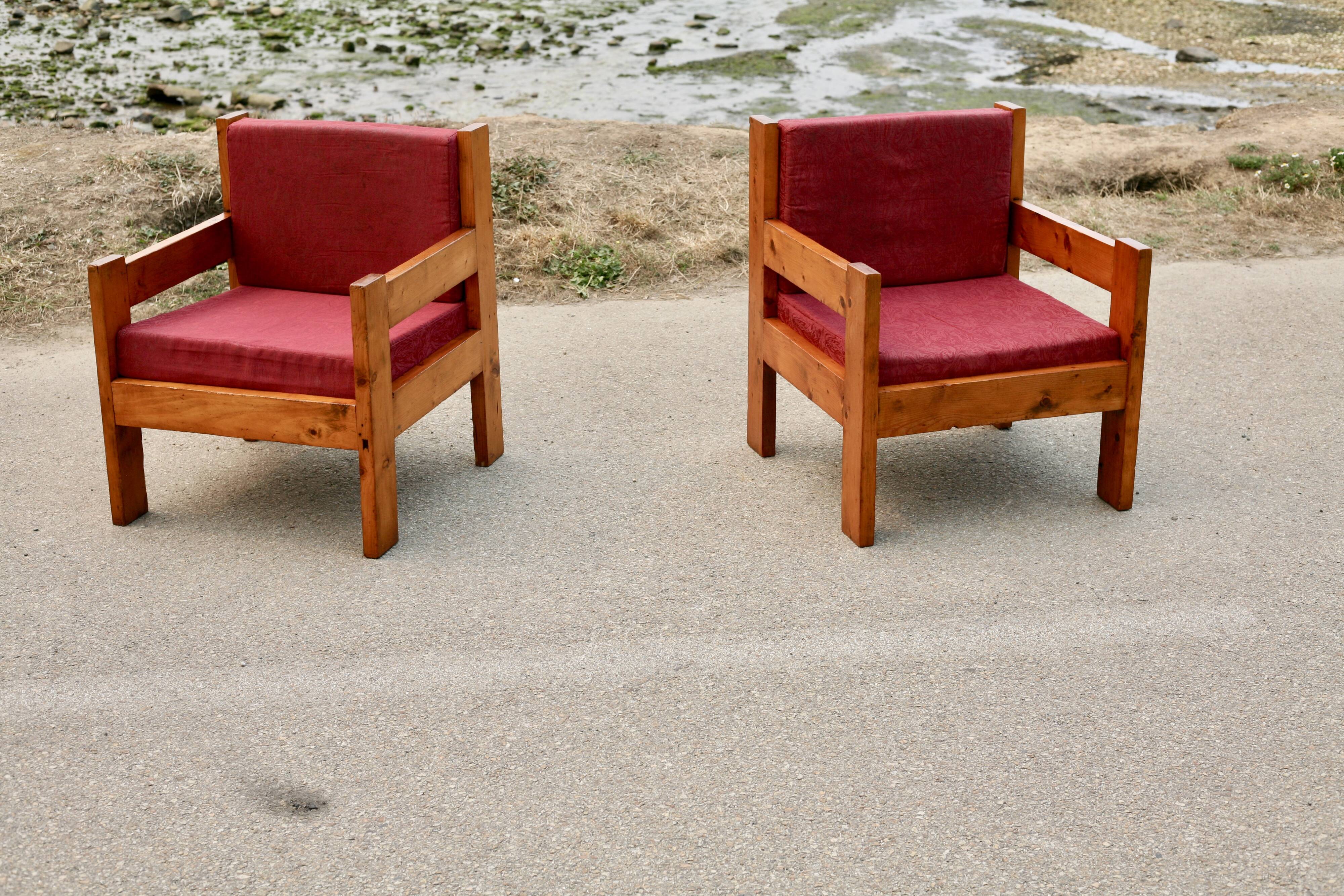 Pair of pine fireside chairs, France, 1960s, "raspberry" cushions